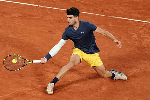 Spain's Carlos Alcaraz Garfia plays a forehand return to Dutch Jesper De Jong during their men's singles match on Court Philippe-Chatrier on day four of the French Open tennis tournament at the Roland Garros Complex in Paris on Wednesday.