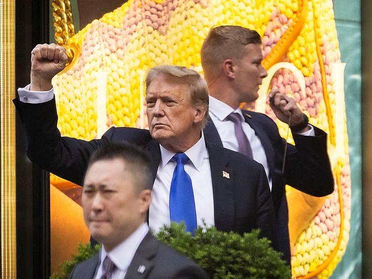 Former US President Donald Trump gestures
