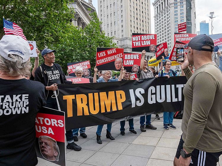 People react moments after news that former US President Donald Trump
