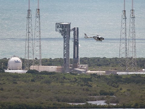 A security helicopter flies past Boeing’s Starliner spacecraft before its flight was scrubbed as it sits atop a United Launch Alliance Atlas V rocket at Space Launch Complex 41 on June 01, 2024, in Cape Canaveral, Florida. 