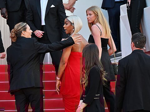 Kelly Rowland isn't happy with this overbearing security guard manning the red carpet at the Cannes Film Festival 