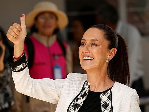 Claudia Sheinbaum, presidential candidate of the ruling MORENA party, gives a thumb up after she voted in the general elections, in Mexico City.