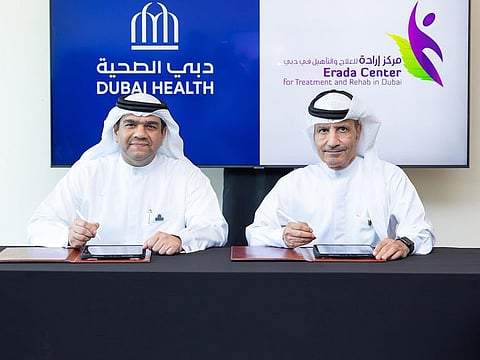 Dr Amer Ahmad Sharif, CEO of Dubai Health(L) and Abdulrazaq Amiri, CEO of the Erada Centre for Treatment and Rehab in Dubai, during the partnership signing ceremony.