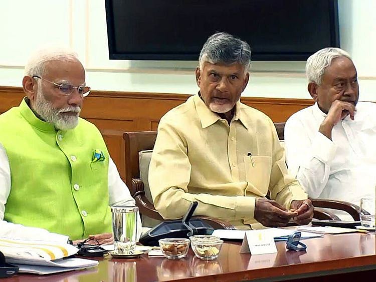Prime Minister Narendra Modi with Telugu Desam Party (TDP) Chief N Chandrababu Naidu and Bihar Chief Minister Nitish Kumar during the National Democratic Alliance (NDA) meeting, at his residence, 7, LKM, in New Delhi on Wednesday.  