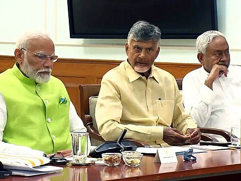 Prime Minister Narendra Modi with Telugu Desam Party (TDP) Chief N Chandrababu Naidu and Bihar Chief Minister Nitish Kumar during the National Democratic Alliance (NDA) meeting, at his residence, 7, LKM, in New Delhi on Wednesday.  