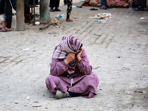 A Palestinian woman at a UN-school housing displacing people that was hit during Israeli bombardment in Nuseirat, in the central Gaza Strip, on June 6, 2024.