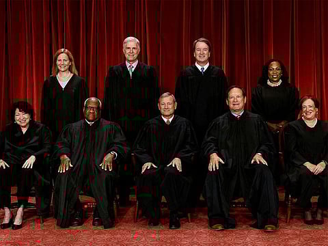 U.S. Supreme Court justices pose for their group portrait at the Supreme Court in Washington, U.S., October 7, 2022. 