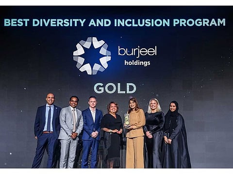 Ms. Madhuri Aswal, Group Director of Human Resources at Burjeel Holdings, receiving the Employee Happiness Award in the Diversity & Inclusion Initiative category at a ceremony held in Dubai. 