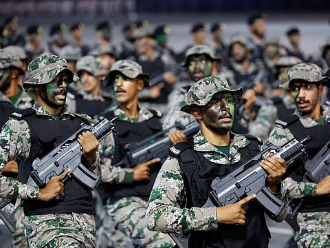 Members of Saudi security forces participate in a parade in preparation for the annual Hajj pilgrimage, in Mecca on June 10, 2024.  