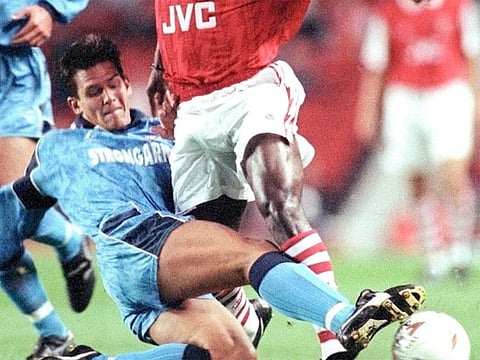 Arsenal striker Kevin Campbell (R) is challenged by Hartlepool United's Phil Gilchrist during their League Cup second round second leg match at Highbury in London October 5, 1994