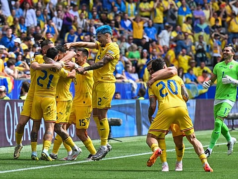 Romania's midfielder Nicolae Stanciu (left) celebrates with teammates scoring his team's first goal during the Uefa Euro 2024 Group E football match against Ukraine at the Munich Football Arena in Munich on Monday.