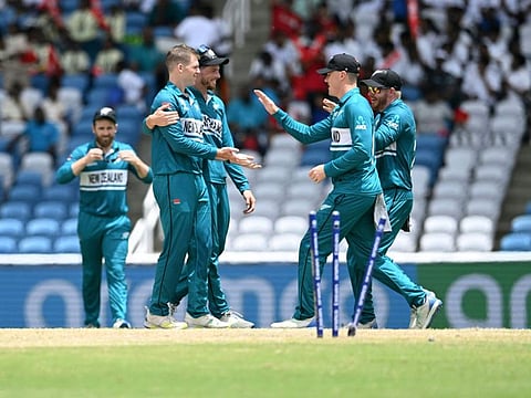 New Zealand's players congratulate New Zealand's Lockie Ferguson after dismissing Papua New Guinea's Chad Soper during the ICC men's Twenty20 World Cup 2024 group C cricket match at Brian Lara Cricket Academy Stadium in Tarouba, Trinidad and Tobago on Monday.