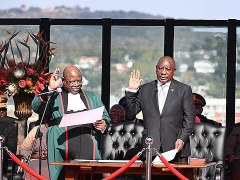 Cyril Ramaphosa, South Africa's president-elect, right, takes the oath of office at his inauguration ceremony at the Union buildings in Pretoria, South Africa, on Wednesday, June 19, 2024.  