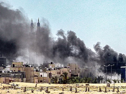 Smoke plumes billow during ongoing battles in the Sultan neighbourhood in the northwest of Rafah in Gaza