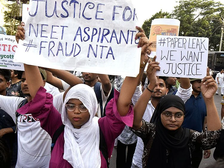 OPN Students stage a protest against the alleged irregularities in the NEET-UG examination results and demand re-examination, in Kolkata on Monday