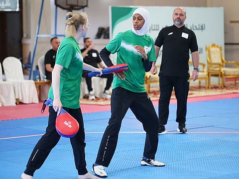 Saudi taekwondo competitor Donia Abu Taleb (centre) attends a training camp in Abha. 