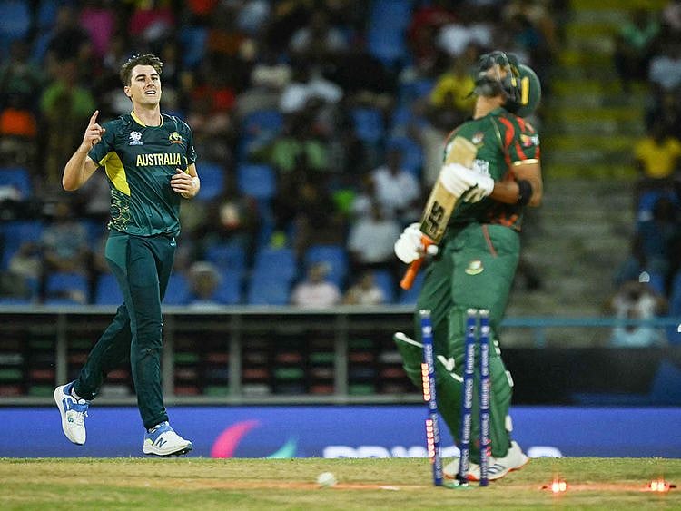 Australia's Pat Cummins (L) celebrates