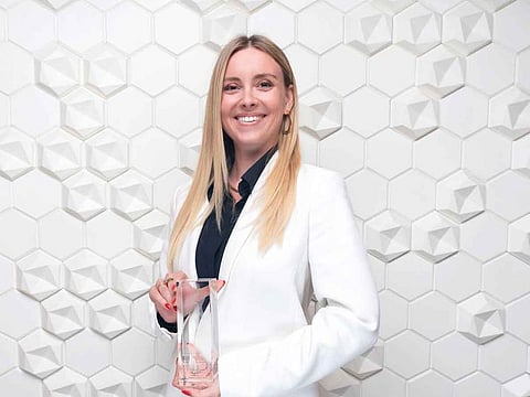 Maryne Cotty Eslous with her Excellence Awards 