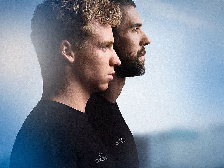 Léon Marchand (left) and Michael Phelps