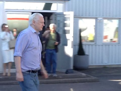 WikiLeaks founder Julian Assange walks to board a plane at a location given as London in this still image from video released on June 25, 2024.   