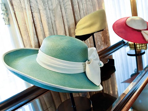 Princess Diana's hats by Philip Somerville (L-R) 1989 teal hat, 1987 yellow and black turban, and red and cream straw hat worn on tour in Australia are on display at Julien's Auctions' press preview of "Princess Diana's Elegance & a Royal Collection", ahead of an exclusive private showing.