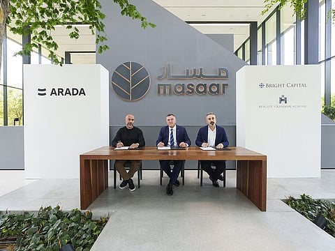 Officials from Arada Reigate Grammar School and Bright Capital Investment sign the partnership agreement at Masaar.