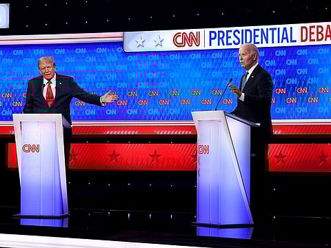 US President Joe Biden (R) and Republican presidential candidate, former US President Donald Trump participate in the CNN Presidential Debate at the CNN Studios on June 27, 2024 in Atlanta, Georgia. 