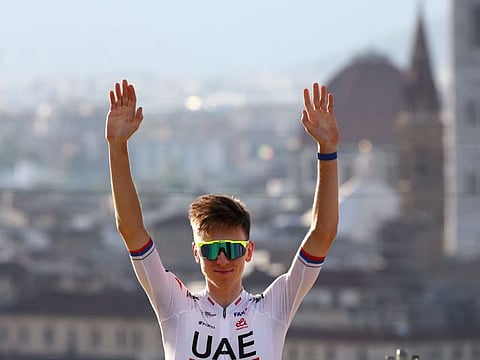 UAE Team Emirates' Tadej Pogacar waves during the team presentation for the 111th edition of the Tour de France race in Florence Thursday.