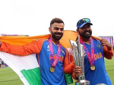 India's Virat Kohli and Rohit Sharma celebrate with the trophy after winning the T20 World Cup 