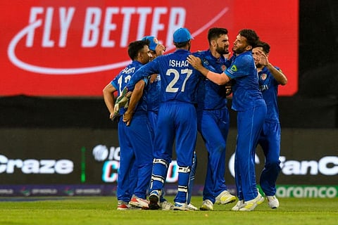 Afghanistan's Naveen-ul-Haq (centre) celebrates the dismissal of Bangladesh's vice-captain Taskin Ahmed during the ICC men's Twenty20 World Cup 2024 Super Eight match at Arnos Vale Stadium in Arnos Vale, Saint Vincent and the Grenadines on June 24.