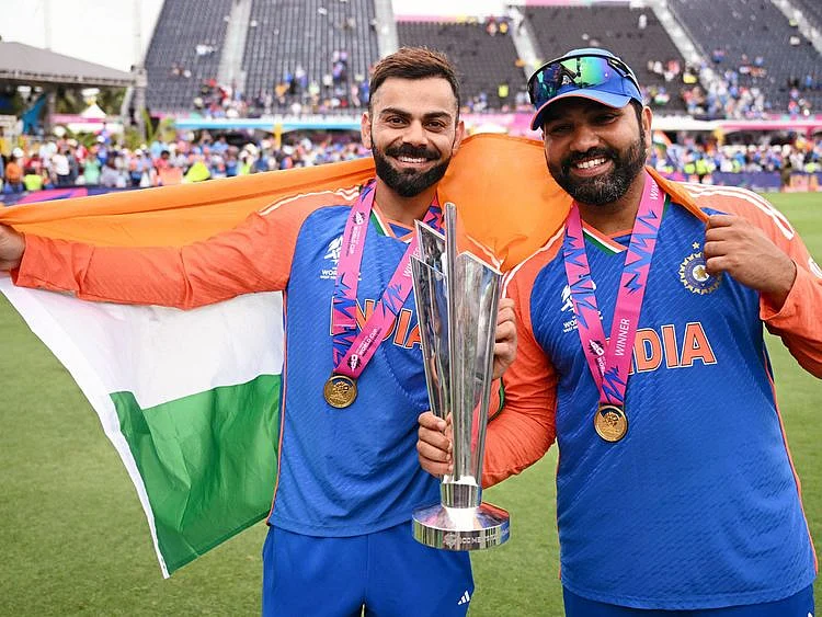 India’s captain Rohit Sharma (right) and Virat Kohli pose with the T20 World Cup after beating South Africa by seven runs in the final at Kensington Oval in Barbados on June 29, 2024. Rohit and Kohli retired from T20 Internationals after the match.