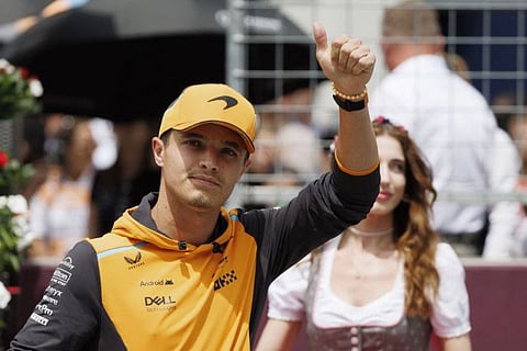 McLaren's British driver Lando Norris takes part in the Drivers Parade ahead of the Formula One Austrian Grand Prix on the Red Bull Ring race track in Spielberg, Austria, on June 30.