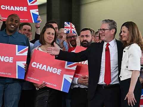 Britain's Labour Party leader Keir Starmer stands with his wife Victoria during a victory rally at the Tate Modern in London early on July 5, 2024.  