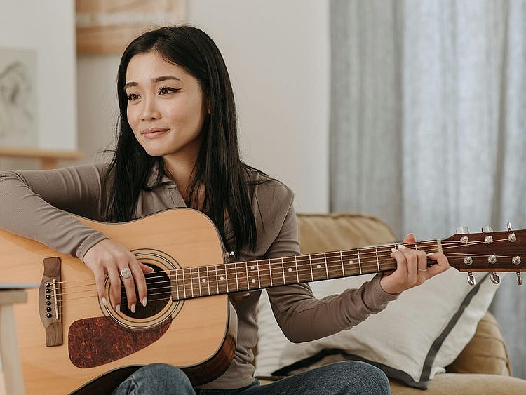 Woman playing guitar