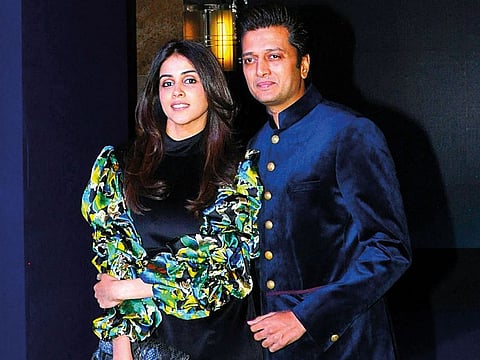 Bollywood actors Genelia D'Souza (L) and husband Riteish Deshmukh (R).