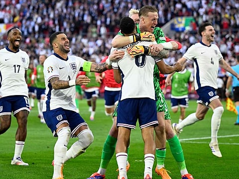 England's forward Ivan Toney, defender Kyle Walker, defender Trent Alexander-Arnold, goalkeeper Jordan Pickford and midfielder Declan Rice celebrate after winning the Uefa Euro 2024 quarter-final football match at the Duesseldorf Arena in Duesseldorf on July 6.