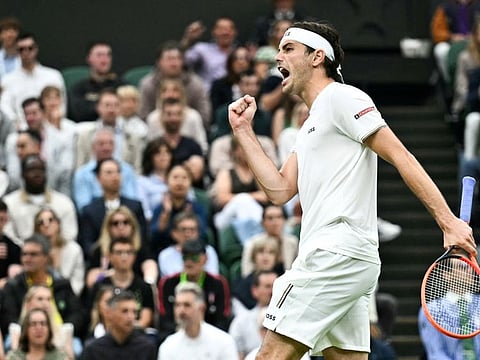 US player Taylor Fritz celebrates winning the fourth set against Germany's Alexander Zverev during their men's singles tennis match on the eighth day of the 2024 Wimbledon Championships at The All England Lawn Tennis and Croquet Club in Wimbledon, southwest London, on Monday.