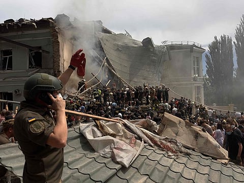 Rescuers clear the rubble of the destroyed Ohmatdyt Children's Hospital following a missile attack in Kyiv on July 8, 2024.