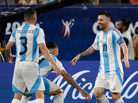 Argentina's Lionel Messi celebrates with teammates after scoring his team's second goal during the Copa America semi-finals against Canada.