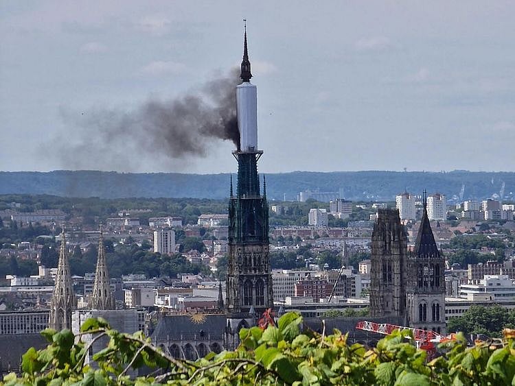 Smoke billows from the spire of Rouen Cathedral, northern France, on July 11, 2024.  