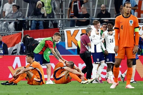 England's defender Kieran Trippier (2nd L), midfielder Tijani Reijnders (L) and defender Stefan de Vrij (3rd L) react after England won the  Uefa Euro 2024 semi-final football match at the BVB Stadion in Dortmund on Wednesday.