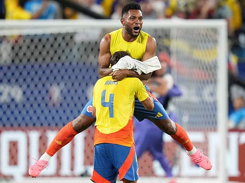 Santiago Arias of Colombia celebrates the team's progression to the final with Miguel Borja of Colombia during the CONMEBOL Copa America 2024 semi-final match against Uruguay at Bank of America Stadium on Wednesday.