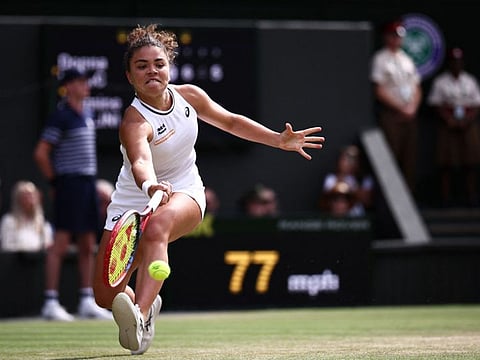 Italy's Jasmine Paolini returns against Croatia's Donna Vekic during their women's singles semi-final tennis match at The All England Lawn Tennis and Croquet Club in Wimbledon, southwest London, on Thursday.