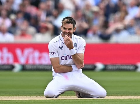 England's James Anderson reacts after dropping a catch off his own bowling against West Indies on Friday.
