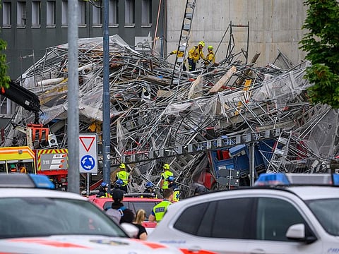Swiss Police and rescuers work at the site of a collapsed scaffolding in the Malley suburb of Lausanne, Switzerland, on July 12, 2024.  