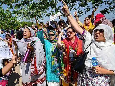 Supporters of Pakistan's former prime minister and Pakistan Tehreek-e-Insaaf (PTI) party leader Imran Khan, celebrate after a court verdict overturned his illegal marriage conviction, outside the court building in Islamabad on July 13, 2024. 