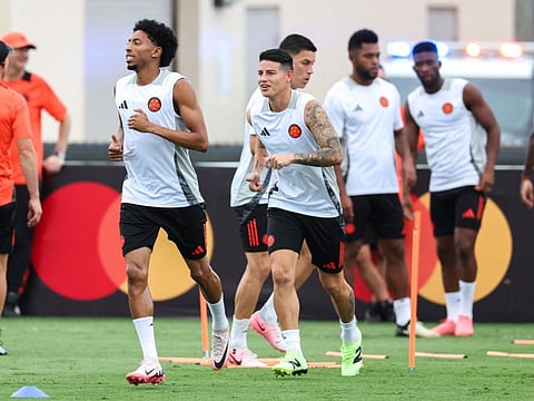 Colombia's midfielder james rodriguez (centre) and defender Johan Mojica (left) attend a training session before the Conmebol 2024 Copa America tournament final football match against Argentina at Barry University in Miami Shores, Florida, on Saturday.