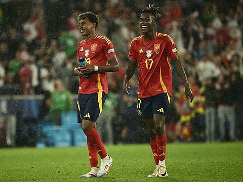 Spain's forward #19 Lamine Yamal and Spain's midfielder #17 Nico Williams.