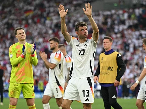 Germany's forward Thomas Mueller greets the fans after the Uefa Euro 2024 quarter-final football match against Spain at the Stuttgart Arena in Stuttgart on July 5.