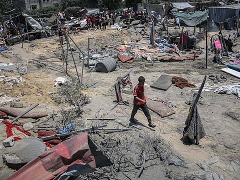 Destroyed tents at the site of an Israeli strike at a camp for displaced Palestinians in the Al Mawasi district of Khan Younis.